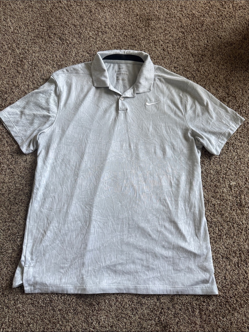 Nike Menโs Light Gray Polo with Subtle Texture